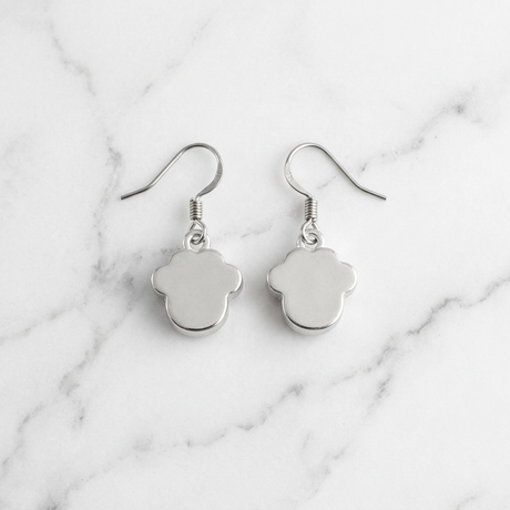 Back of pink paw print earrings showing the silver-toned reverse and surgical steel fish hook wires