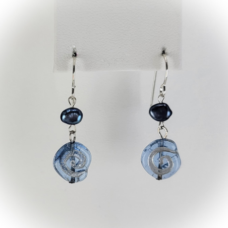 Sterling silver earrings with blue freshwater pearls and transparent roughly circular blue glass beads with frosted silver swirls