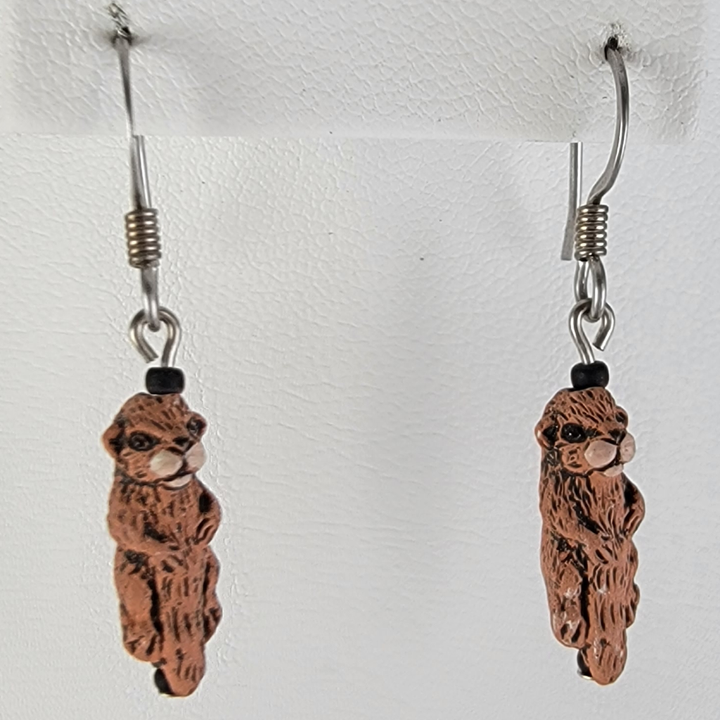 Handmade, hypoallergenic earrings with tiny ceramic brown otters 