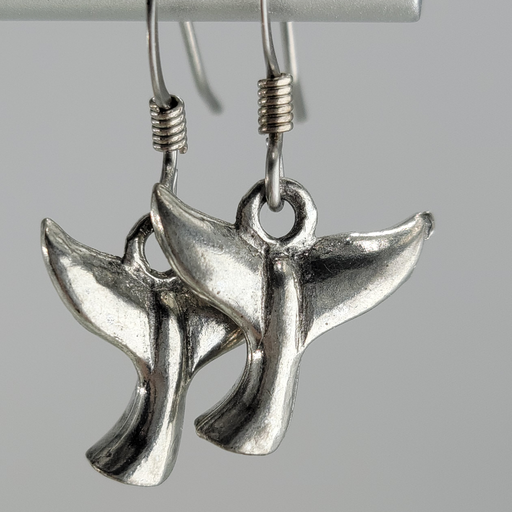 Handmade, hypoallergenic earrings with silver colored whale tails 
