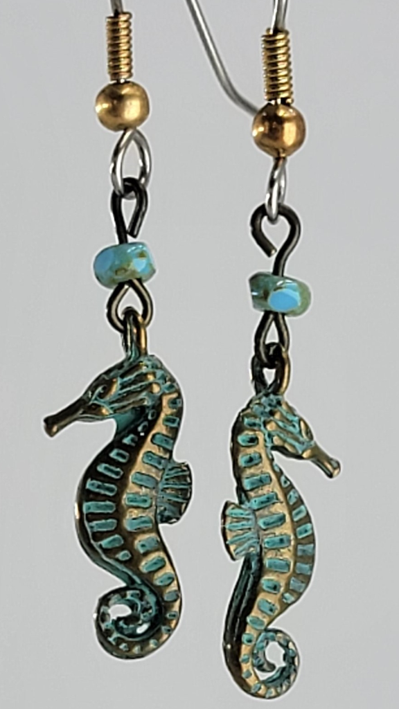Handmade, hypoallergenic earrings with tiny green seahorses and turquoise Picasso glass beads
