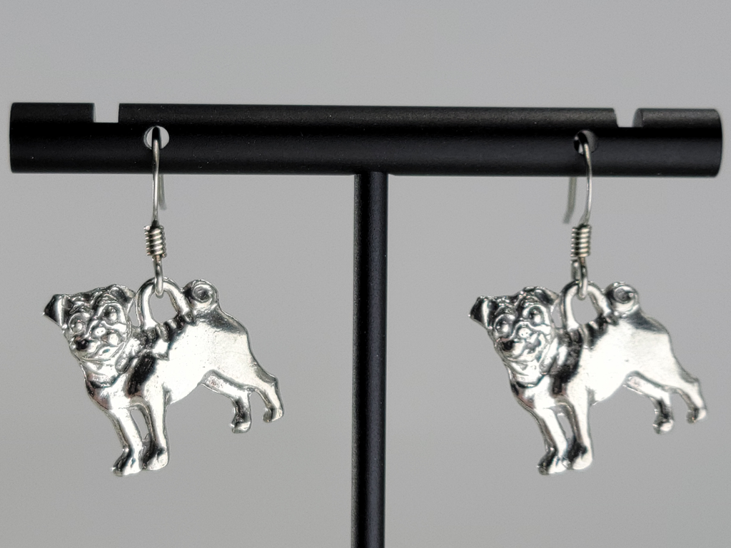 Earrings, silver tone. Pug dogs, standing. Ear wires are silver tone.