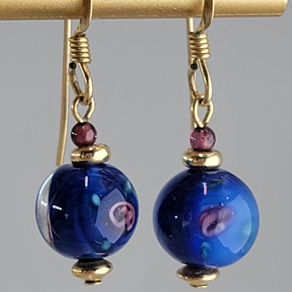 Handmade blue and rose glass bead earrings with garnet and gold disk accents on gold filled wires