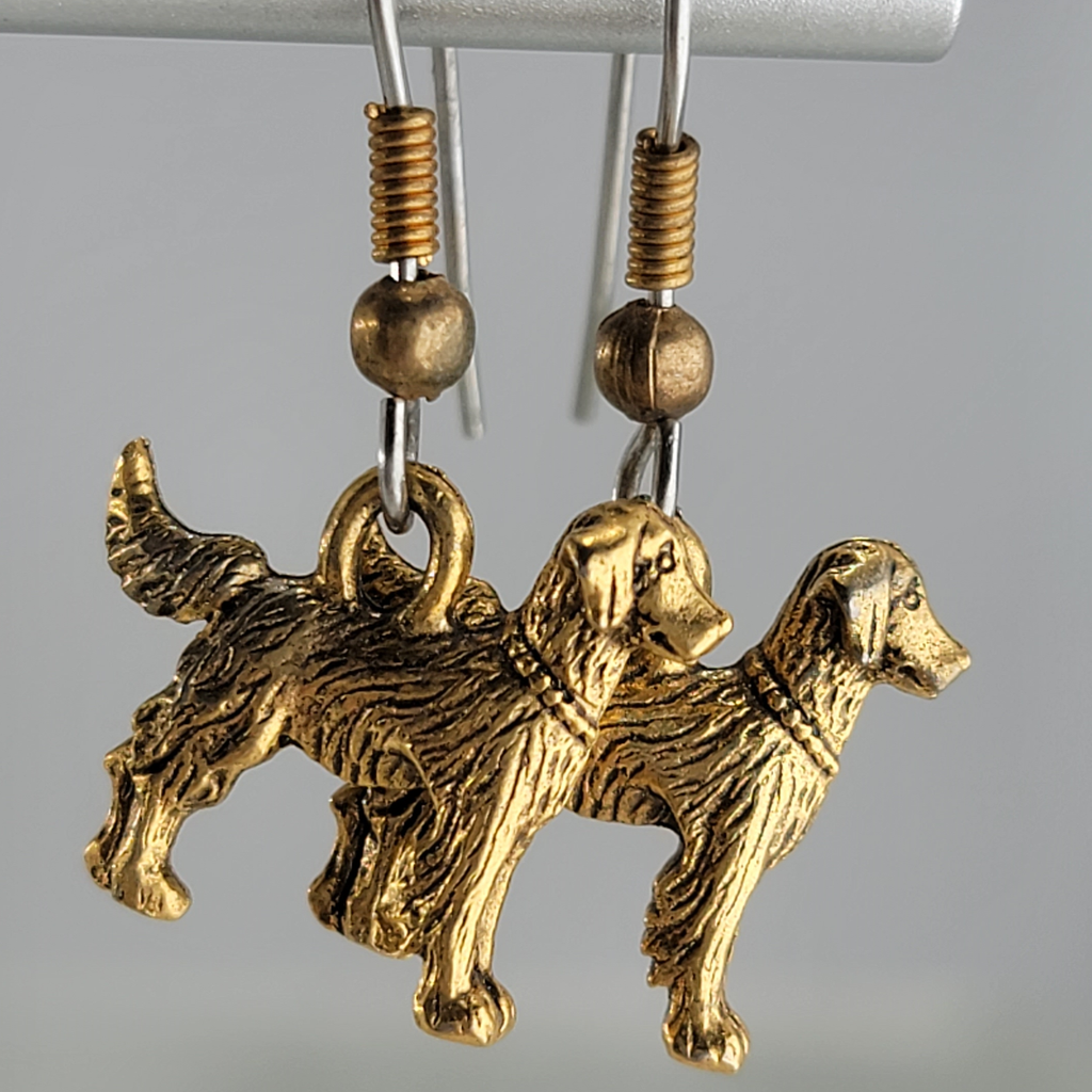 Earrings, golden retriever dogs. Ear wires are silver tone with gold tone bead and spring.