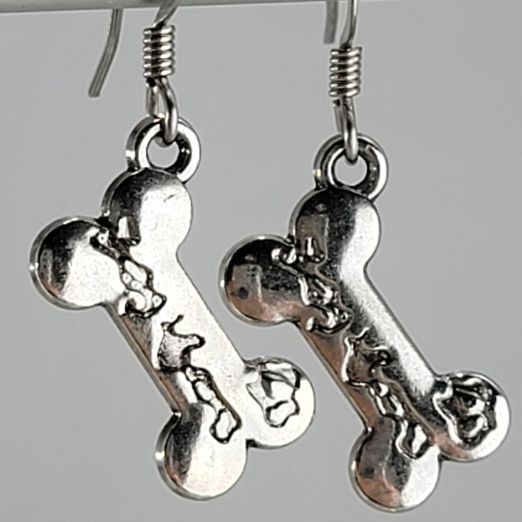 Earrings, silver tone dog bone with etched details. Ear wires are silver tone.