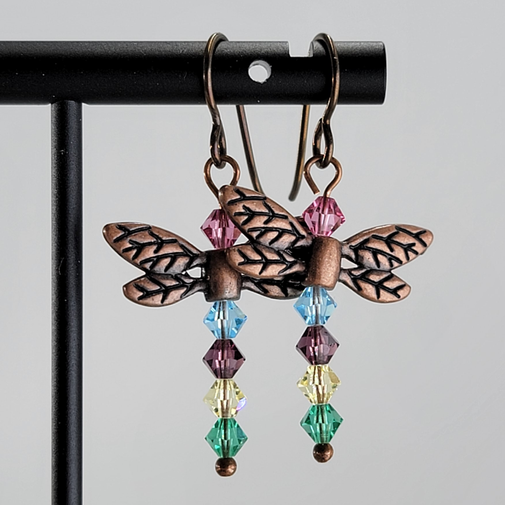 Dragonfly earrings with copper wings and body of crystal beads in multiple colors