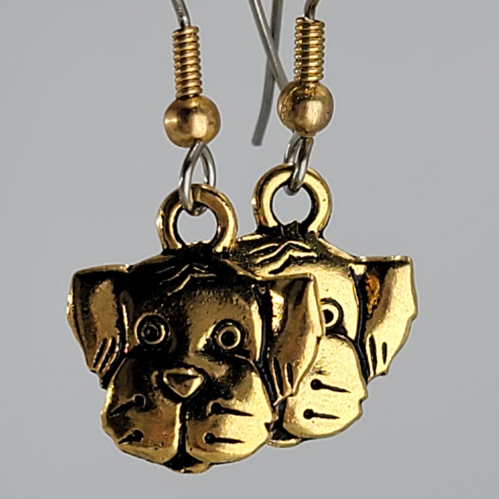 Earrings, gold tone friendly dog face. Ear wires are silver tone with gold tone bead and spring.