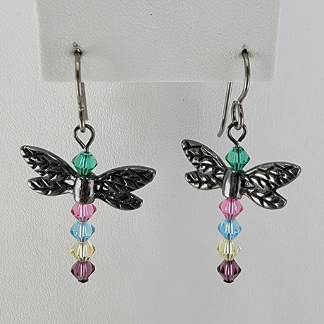 Dragonfly earrings with pewter wings and body of crystal beads in multiple colors