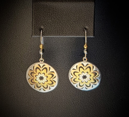 Handmade earrings with silver and gold sun charms and sterling ear wires