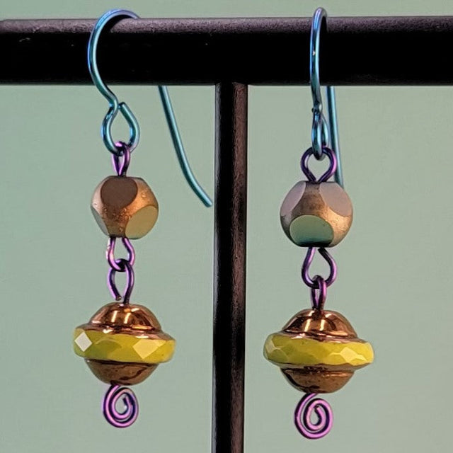 Handmade colorful Boho flying saucer earrings with bright blue hypoallergenic niobium ear wires and colorful Czech glass