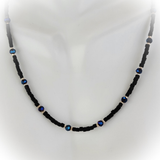 Handmade beaded black and blue necklace with gold filled beads and 14 karat gold filled clasp