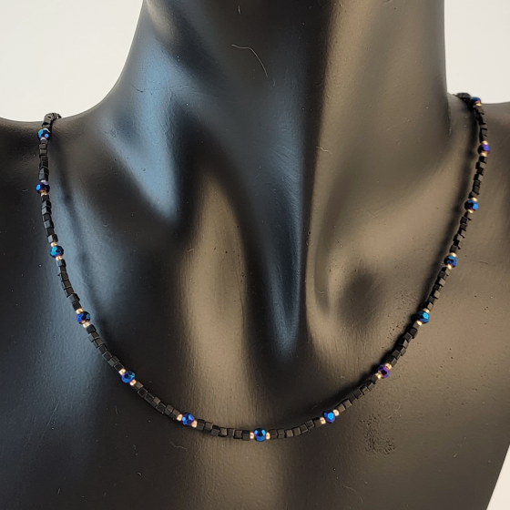 Handmade beaded black and blue necklace with gold filled beads and 14 karat gold filled clasp