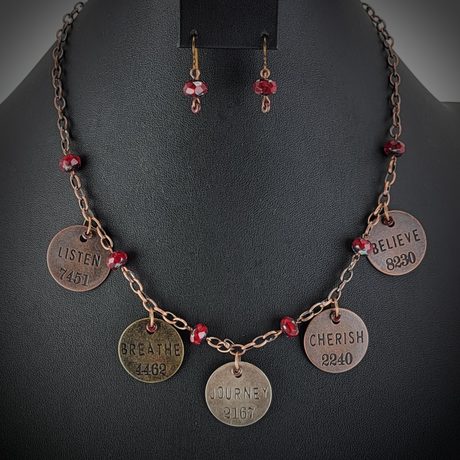Handmade necklace with copper chain, inspirational word tags, and deep red Picasso glass beads