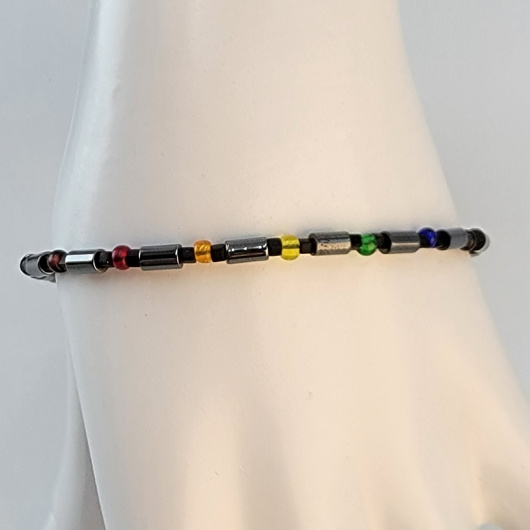 Handmade unisex bracelet with grey hematite beads and Czech glass beads in pride colors