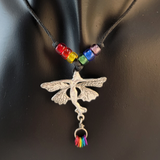 Handmade leather necklace with a pewter fairy pendant, Czech glass beads in pride colors, and small metal rings in pride colors