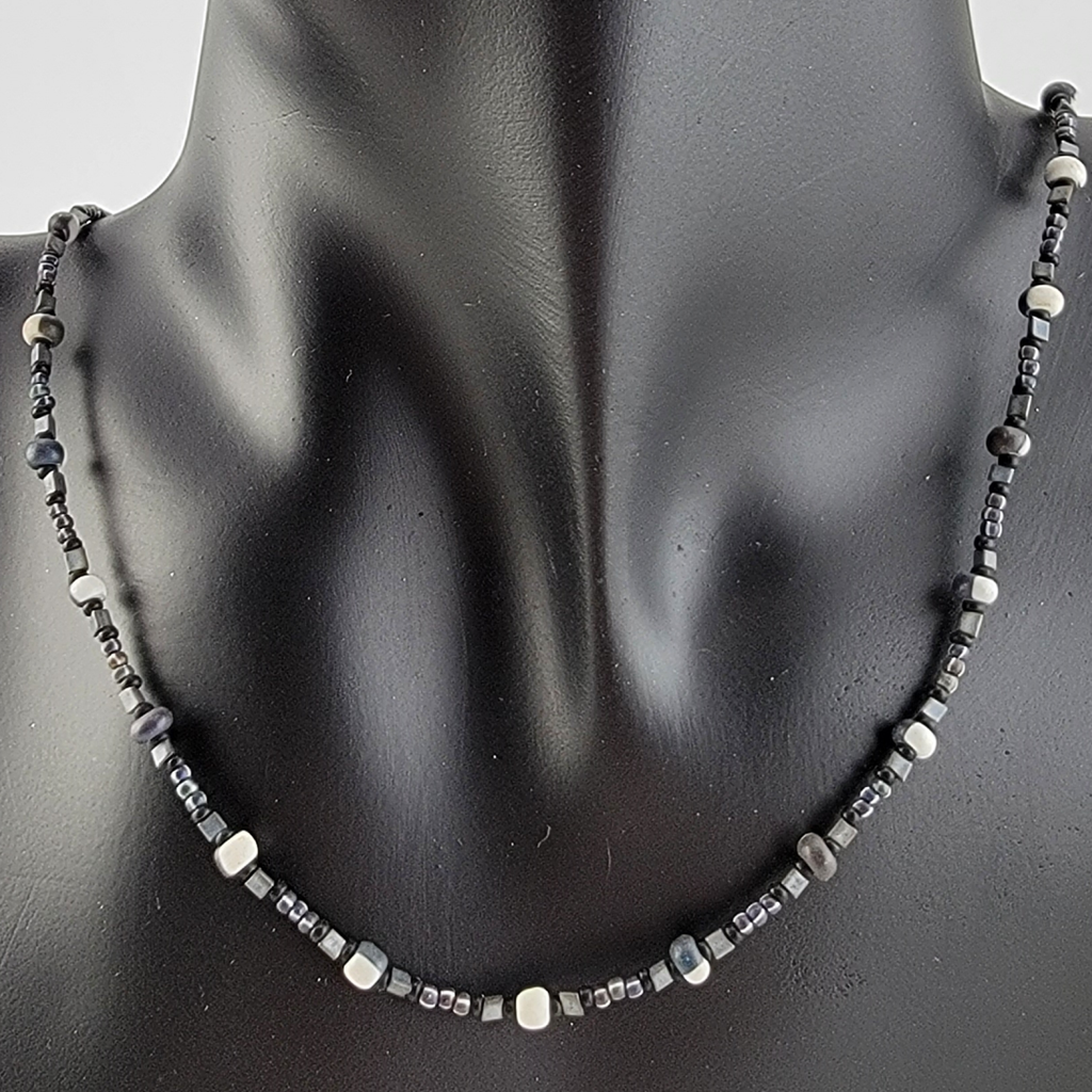 Handmade unisex beaded necklace with seed beads in black and white, grey, and black