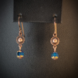 Handmade hypoallergenic earrings with turquoise blue cathedral glass beads and copper suns