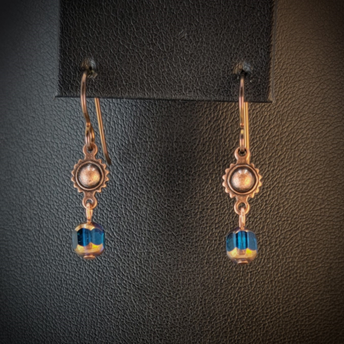 Handmade hypoallergenic earrings with turquoise blue cathedral glass beads and copper suns
