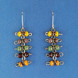 Handmade quirky Boho earrings with five layers of colorful Picasso glass bead barbells. Hypoallergenic stainless steel ear wires. Total earring length is 2 1/8".