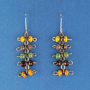 Handmade quirky Boho earrings with five layers of colorful Picasso glass bead barbells. Hypoallergenic stainless steel ear wires. Total earring length is 2 1/8".