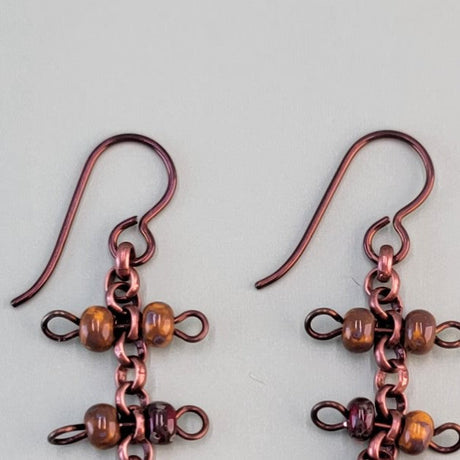 Handmade dangly Boho earrings with hypoallergenic ear wires, antiqued copper chain and brown Picasso glass bead barbells