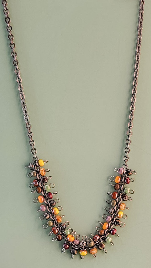 Handmade boho necklace with richly-colored Picasso glass beads on a gunmetal rolo-style chain