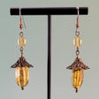 Handmade earrings with vintage amber glass, topaz-colored Czech glass, and hypoallergenic surgical steel ear wires