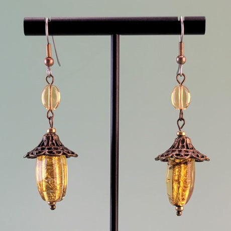 Handmade earrings with vintage amber glass, topaz-colored Czech glass, and hypoallergenic surgical steel ear wires