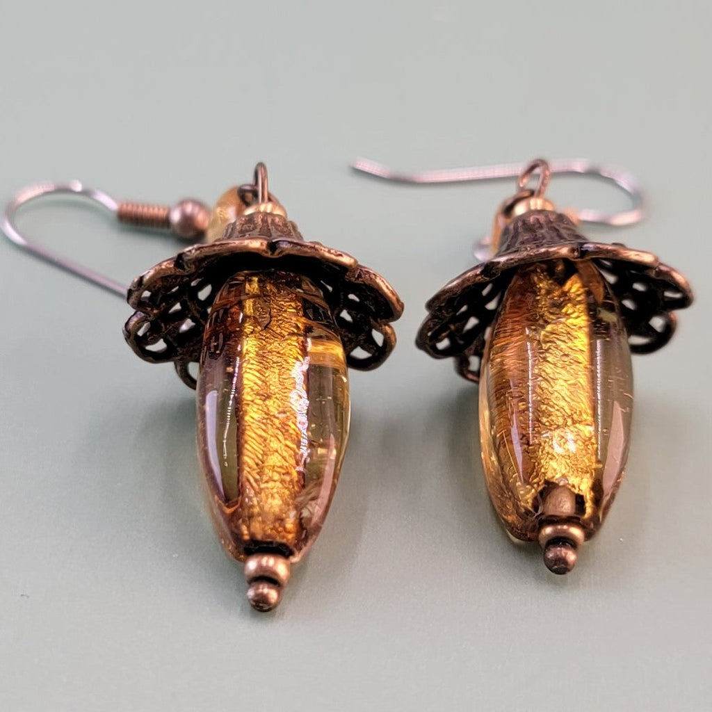 Handmade earrings with vintage amber glass, topaz-colored Czech glass, and hypoallergenic surgical steel ear wires