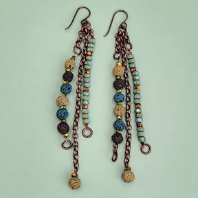 Handmade Boho earrings, triple drop, with lava beads dyed in browns and greens, along with turquoise Picasso glass and antiqued copper chain.
