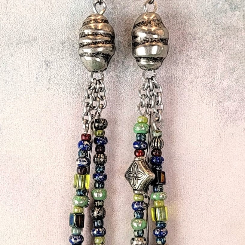 Dangly handmade Boho earrings, triple drops, dazzling blues, greens, and silver. 4 3/4" long, hypoallergenic ear wires. 
