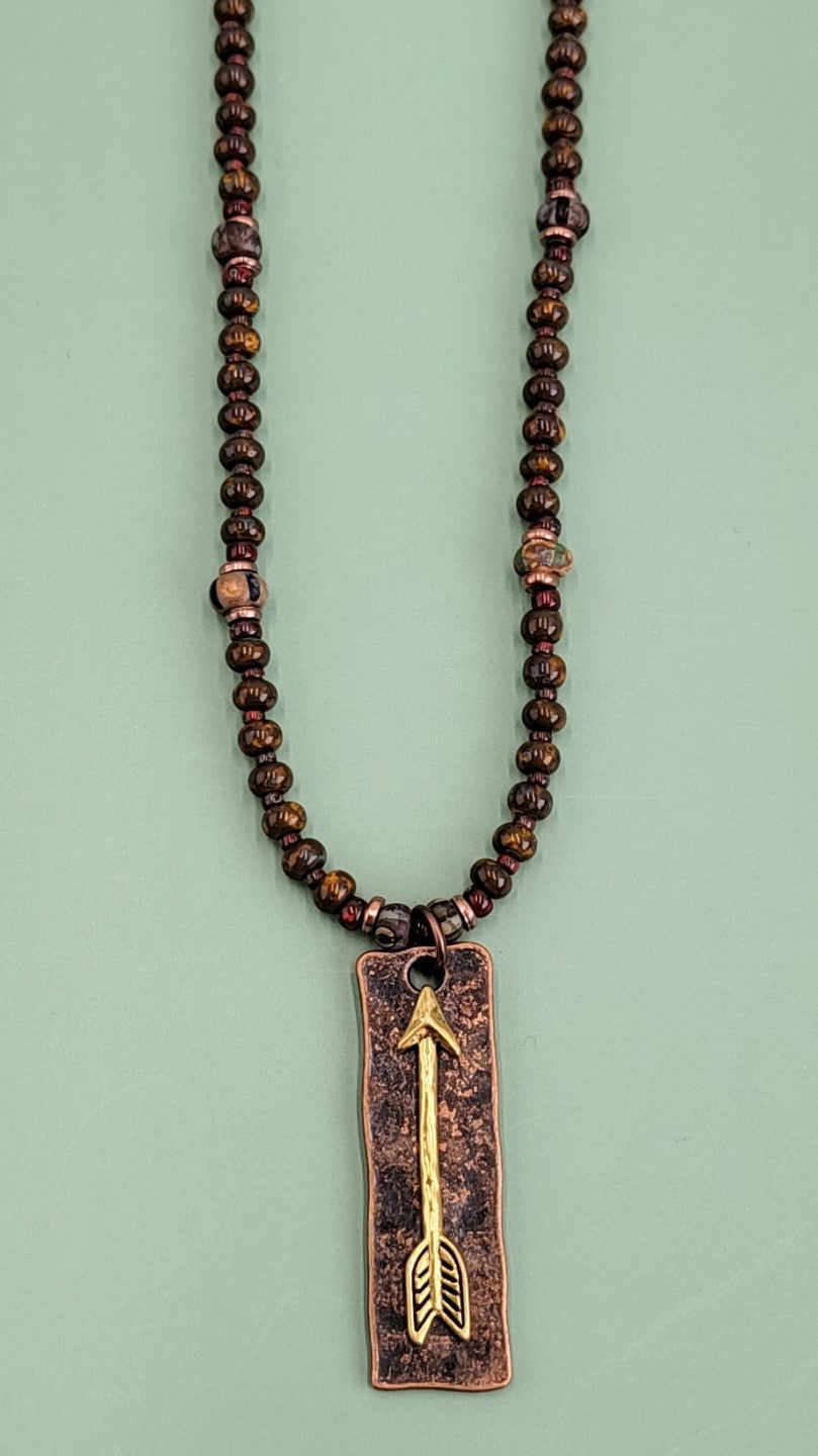Handmade Boho necklace with rustic arrowhead and Picasso glass in rich browns and reds. 