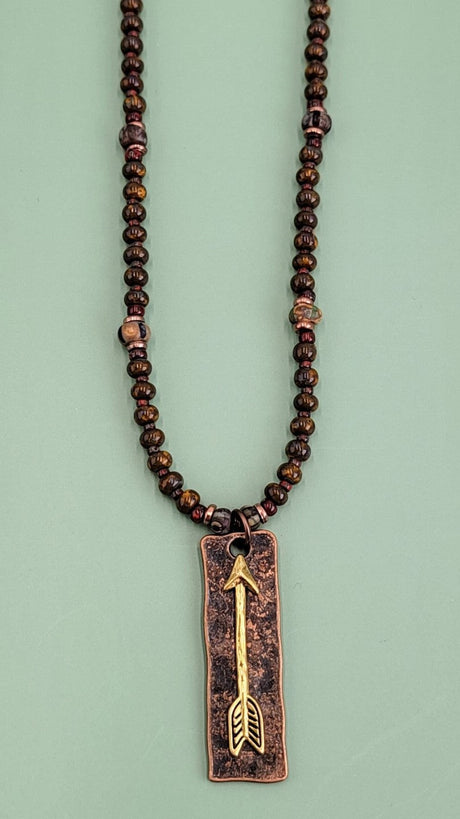 Handmade Boho necklace with rustic arrowhead and Picasso glass in rich browns and reds. 