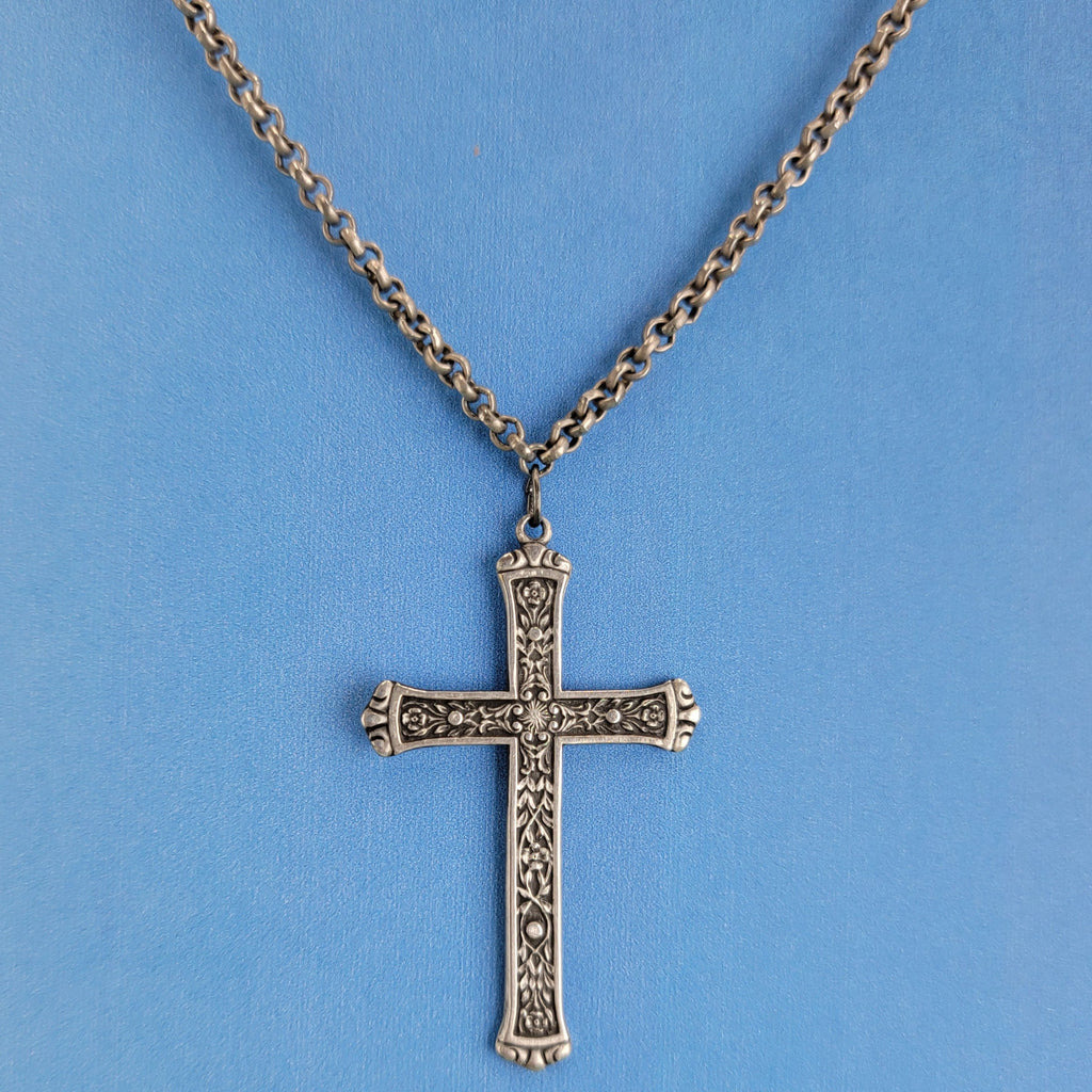 Casual Boho necklace with pewter cross featuring inlaid vines and flowers on antiqued silver tone chain