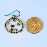 Handmade cat and star earrings including blue enamel cat on blue background looking at green enamel stars