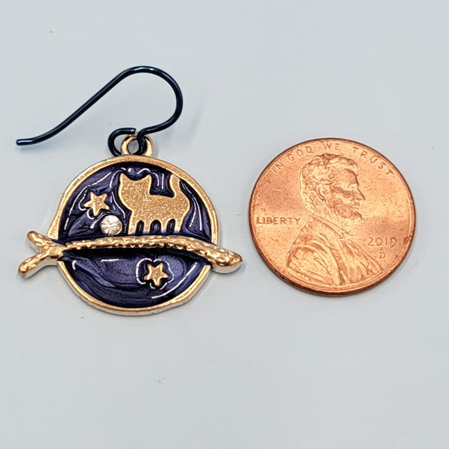 Hypoallergenic handmade cat earrings including gold cat on a branch with blue enamel background and stars