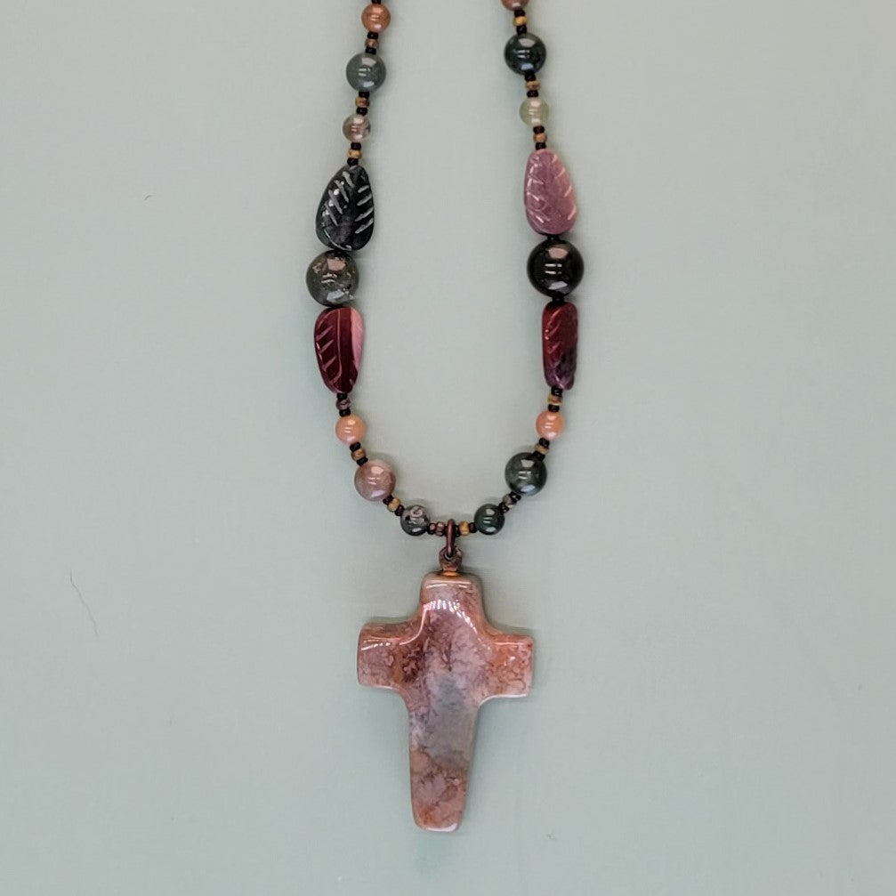 Richly-colored fancy jasper gemstone cross necklace, with more than 60 fancy jasper gemstones in scrumptious greens, lilacs, and turquoise