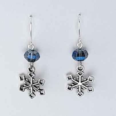 Handmade snowflake earrings with sparkling blue beads, lead-free pewter