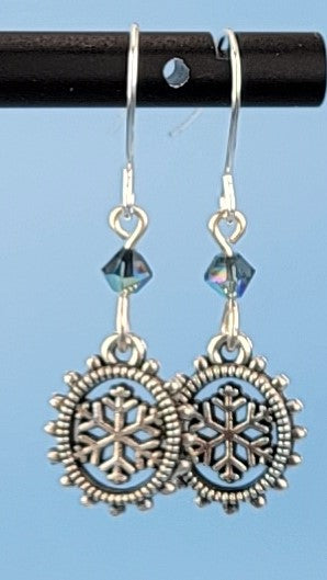 Hypoallergenic snowflake earrings with detailed geometric lead-free pewter snowflake charms and Montana blue crystal