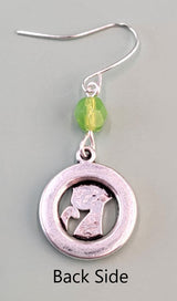 Hypoallergenic silver cat earrings have hammered silver rings with sweet smiling kittens and green Czech glass accent beads