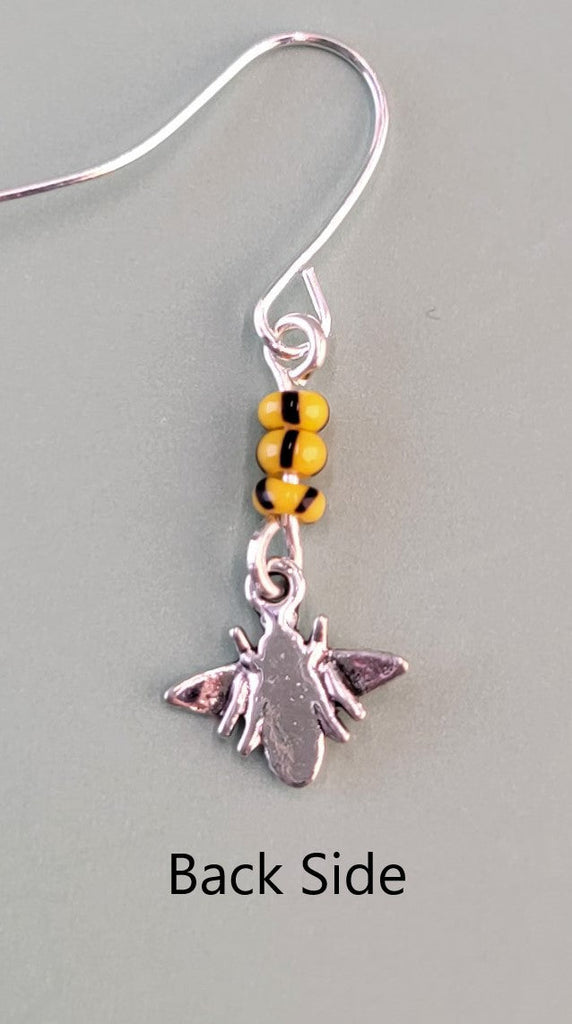 Handmade hypoallergenic bee earrings, each with three yellow and black glass beads