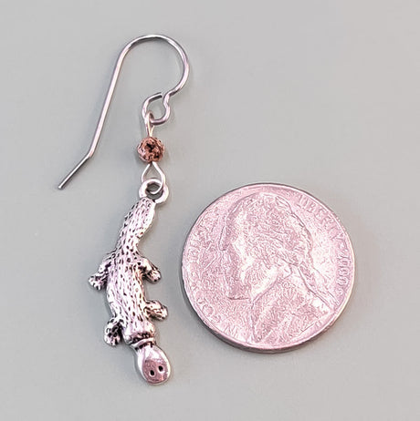 Handmade platypus earrings made with lead-free pewter platypus and brown Czech glass beads