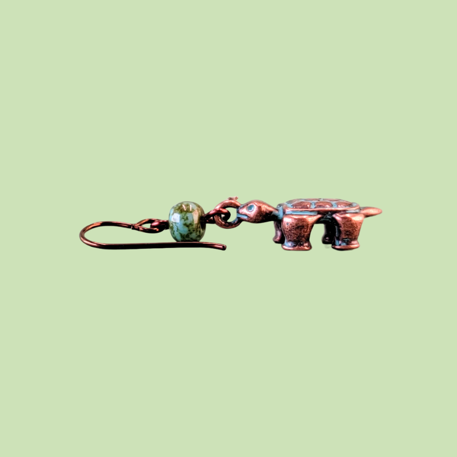 Hypoallergenic copper turtle earrings with three dimensional turtle charms and green Picasso glass beads