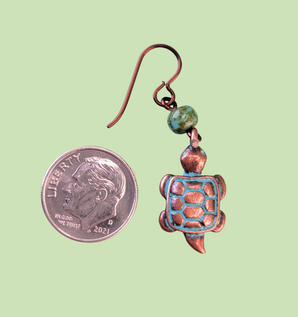 Hypoallergenic copper turtle earrings with three dimensional turtle charms and green Picasso glass beads