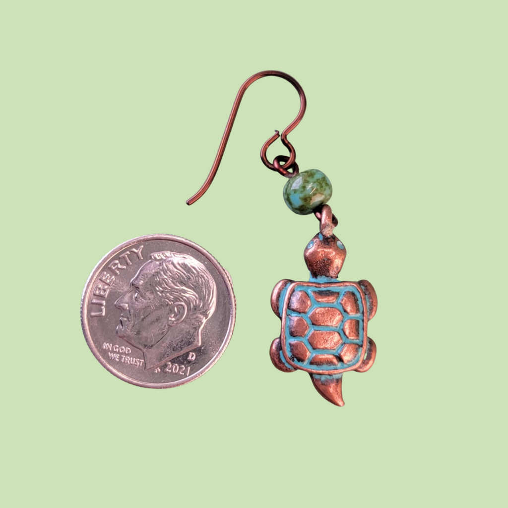 Hypoallergenic copper turtle earrings with three dimensional turtle charms and green Picasso glass beads