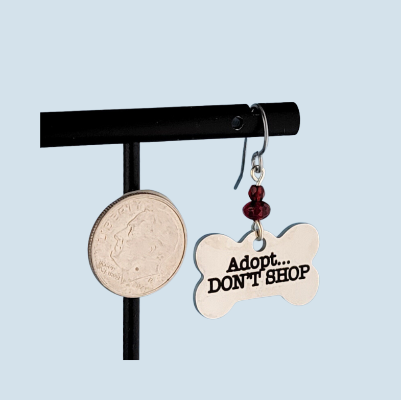 Hypoallergenic adopt don't shop earrings with bone-shaped charms and red Picasso glass