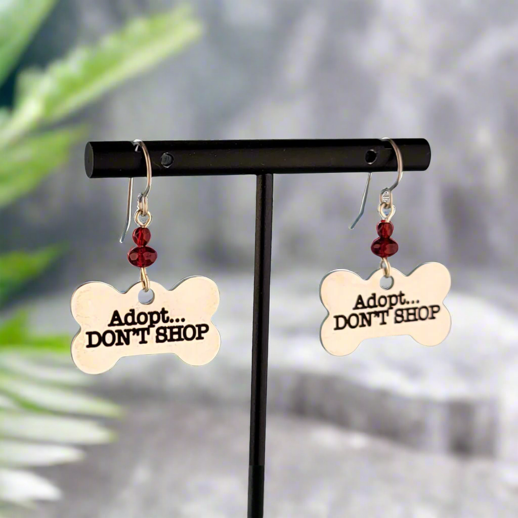 Hypoallergenic adopt don't shop earrings with bone-shaped charms and red Picasso glass