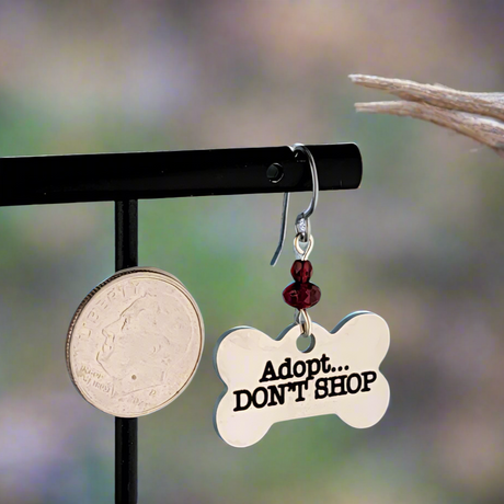 Hypoallergenic adopt don't shop earrings with bone-shaped charms and red Picasso glass