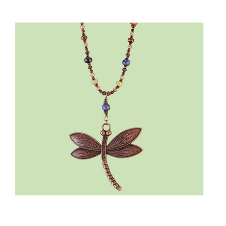 Close-up of an intricate 2.5-inch antiqued bronze dragonfly pendant showing detailed wing textures and earthy Picasso glass bead accents.